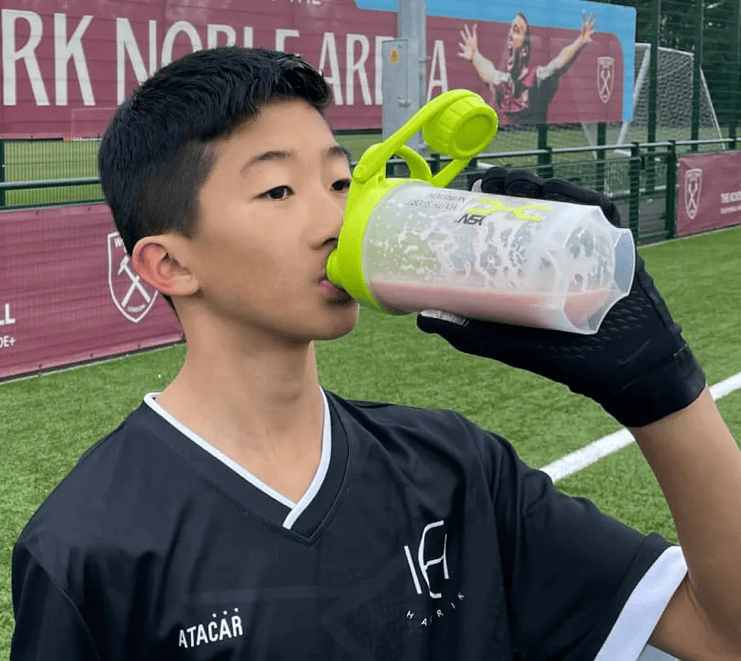 Young footballer drinking a YSN shake