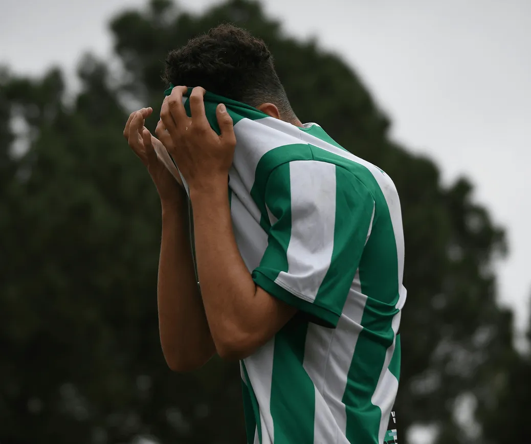 Young player frustrated on the pitch